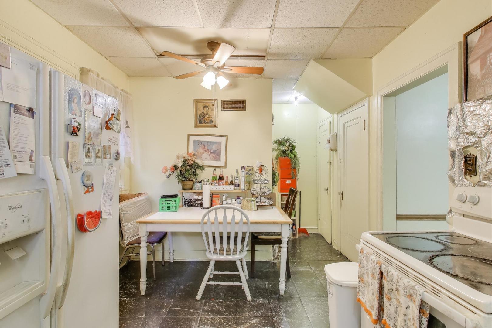 2859 North Mango Avenue Chicago, IL 60634 - Photo 9 of 24 a dining room with furniture and window