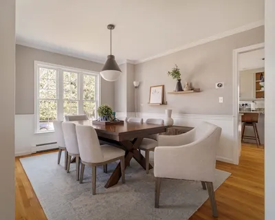 a dining room with furniture window wooden floor