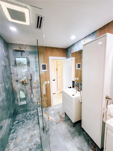 a bathroom with a sink and a shower