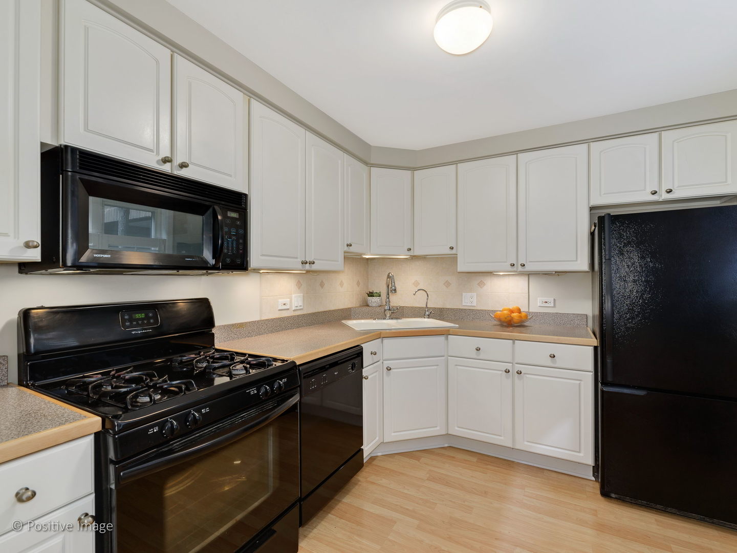 1920 North Mohawk Street, Unit 17 Chicago, IL 60614 - Photo 10 of 28 a kitchen with granite countertop cabinets and steel stainless steel appliances