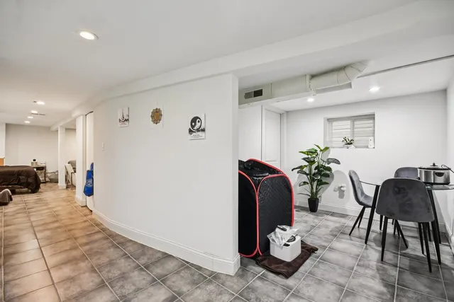 a living room with furniture and white walls
