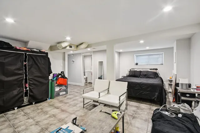 a bedroom with a bed and a closet