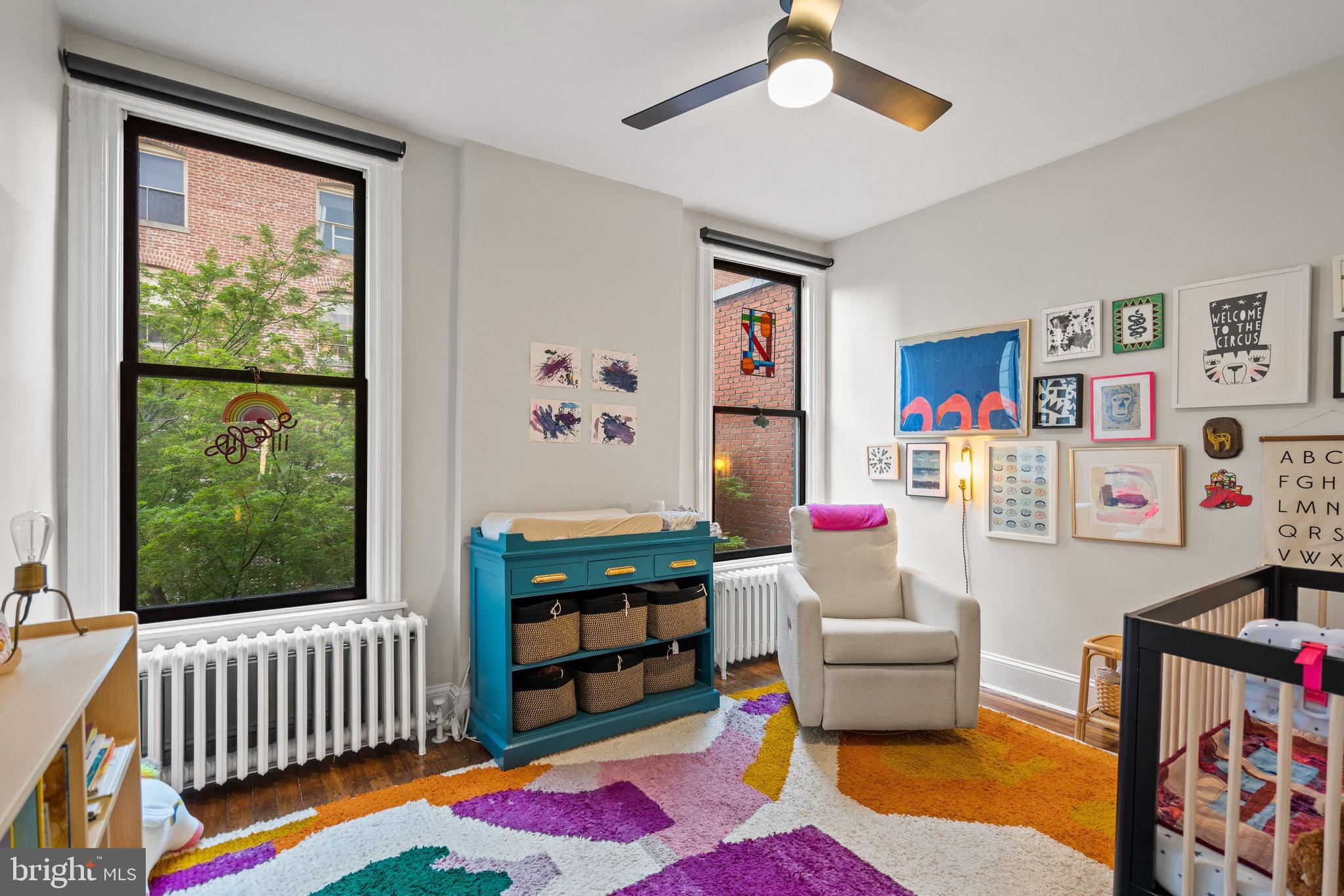 2026 15th Street Northwest Washington, DC 20009 - Photo 27 of 47 a room with furniture a rug and a window