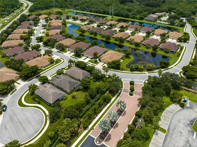an aerial view of a house with outdoor space and street view