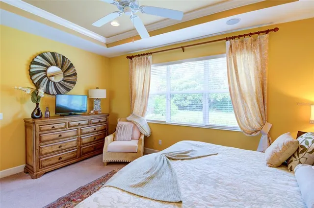 a bathroom with a granite countertop tub a double vanity sink and a mirror