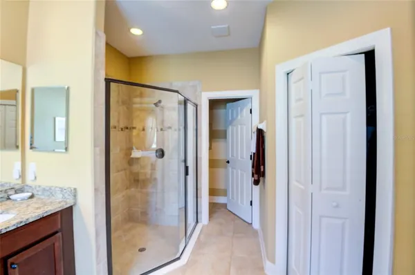 a view of a hallway with wooden shelves
