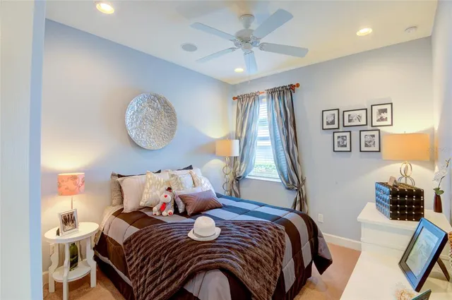 a bedroom with bed and cupboard