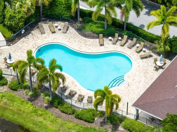 a view of a swimming pool with a patio