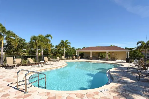 a view of a swimming pool with a lounge chair