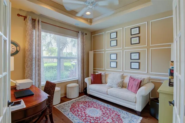 a view of a dining room with furniture wooden floor and chandelier