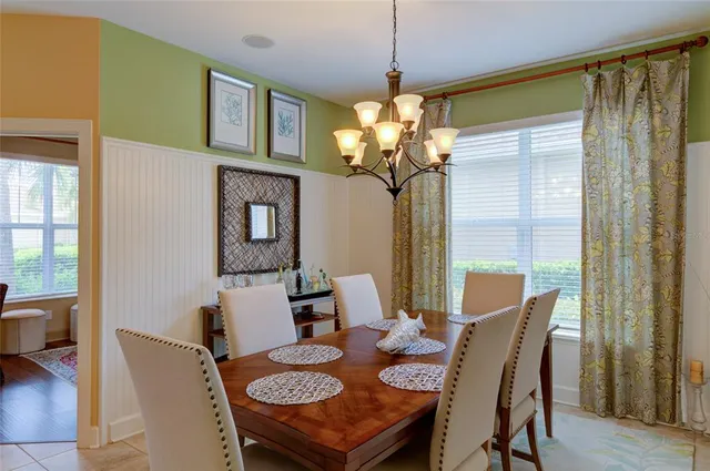 a dining room with furniture and window