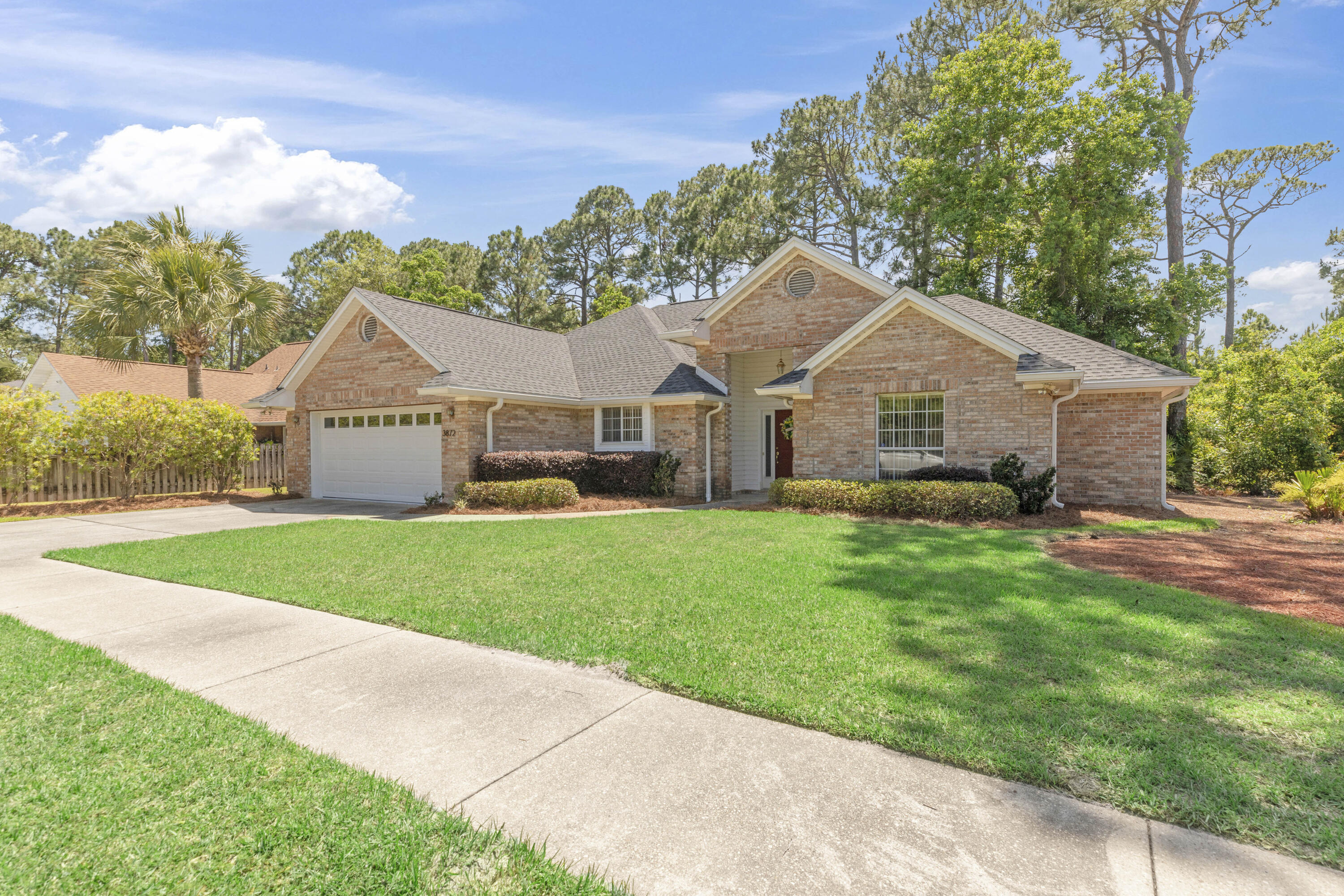 3872 Mesa Road Destin, FL 32541 - Photo 29 of 29 a view of an house with backyard space and garden