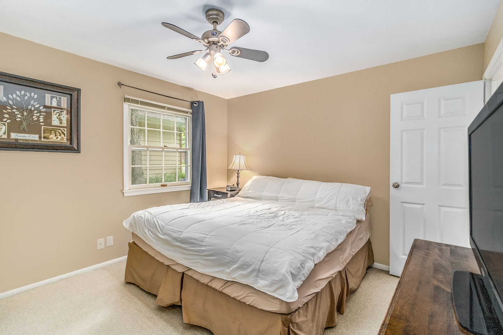 48 Briarcliff Road Montgomery, IL 60538 - Photo 14 of 29 a bedroom with a bed and a chandelier