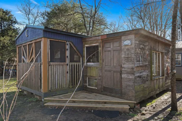 a view of street with large trees