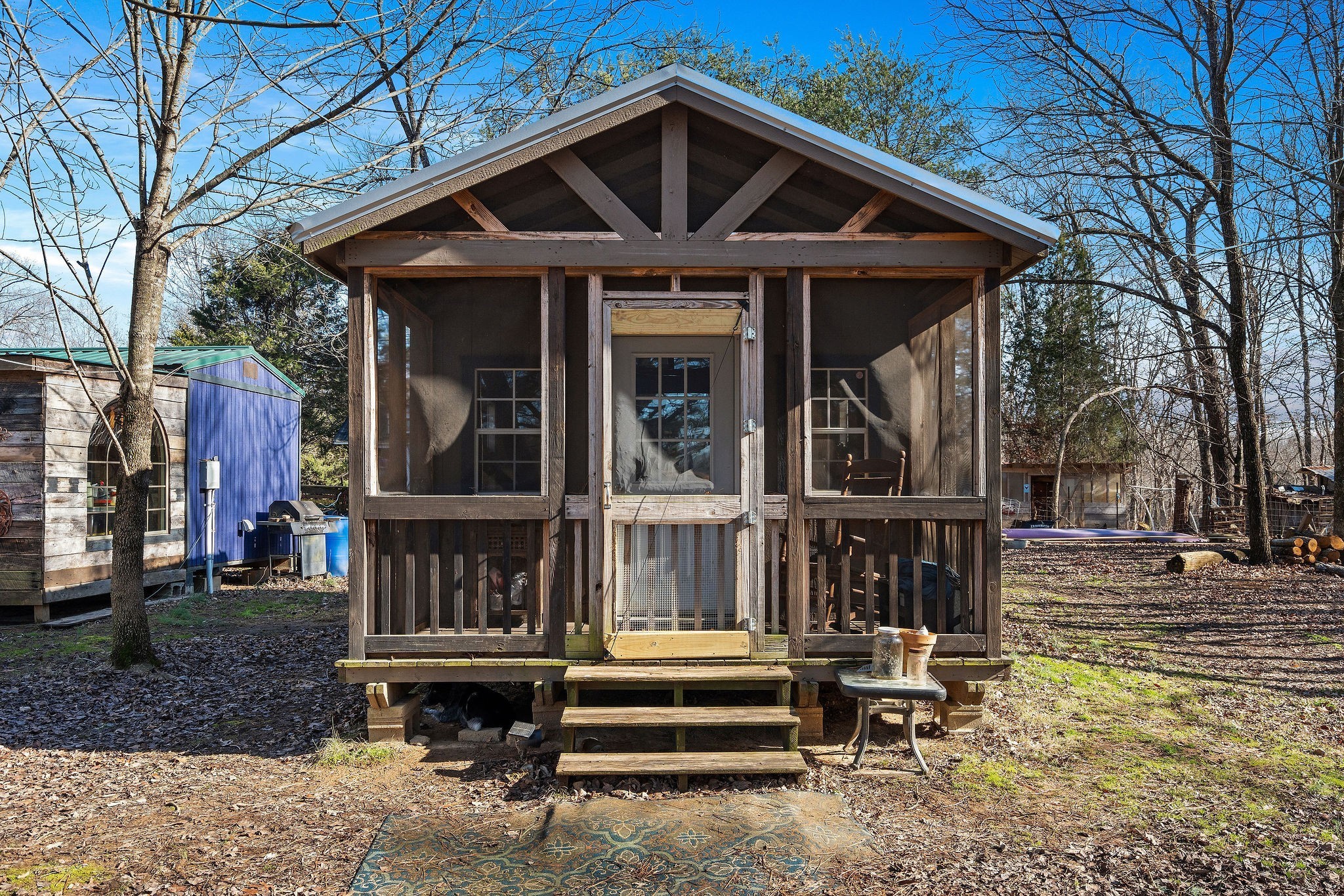 7139 Kingston Road Fairview, TN 37062 - Photo 22 of 48 a view of a house with a large window and wooden fence