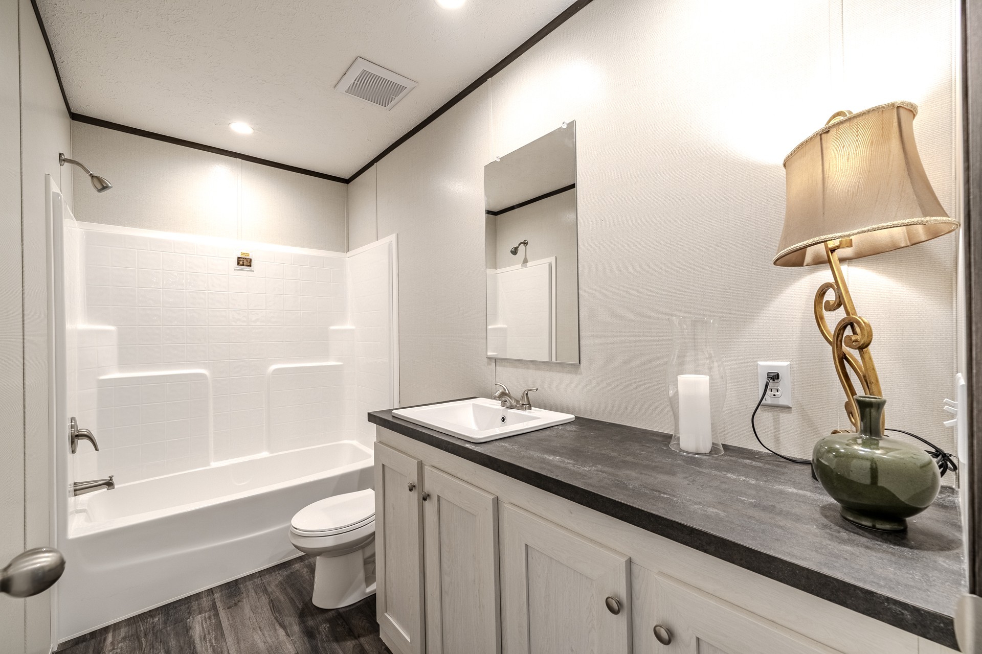 3615 Guys Chewalla Road Ramer, TN 38367 - Photo 24 of 65 a bathroom with a granite countertop sink and a mirror
