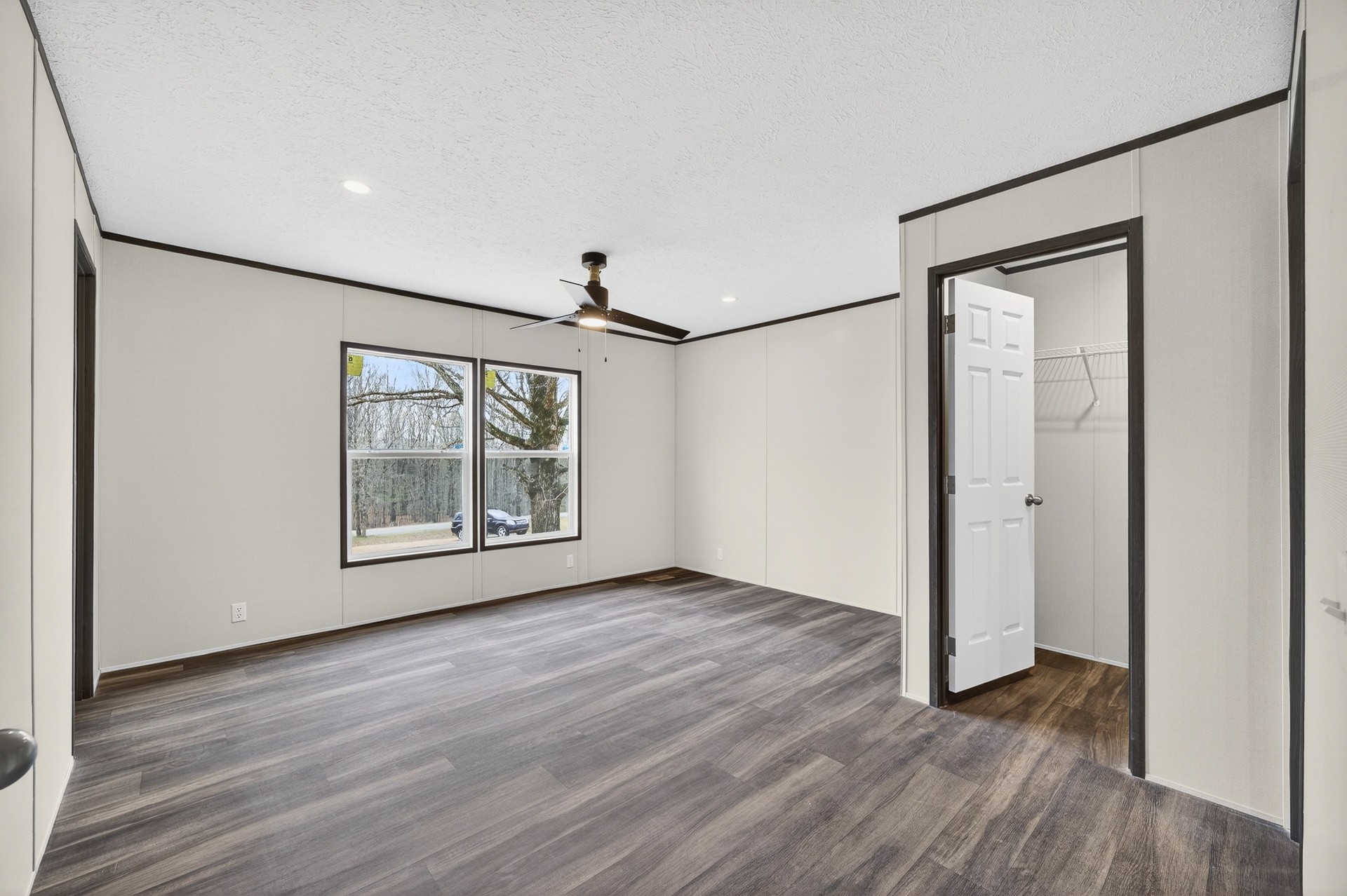 3615 Guys Chewalla Road Ramer, TN 38367 - Photo 28 of 65 an empty room with wooden floor and windows