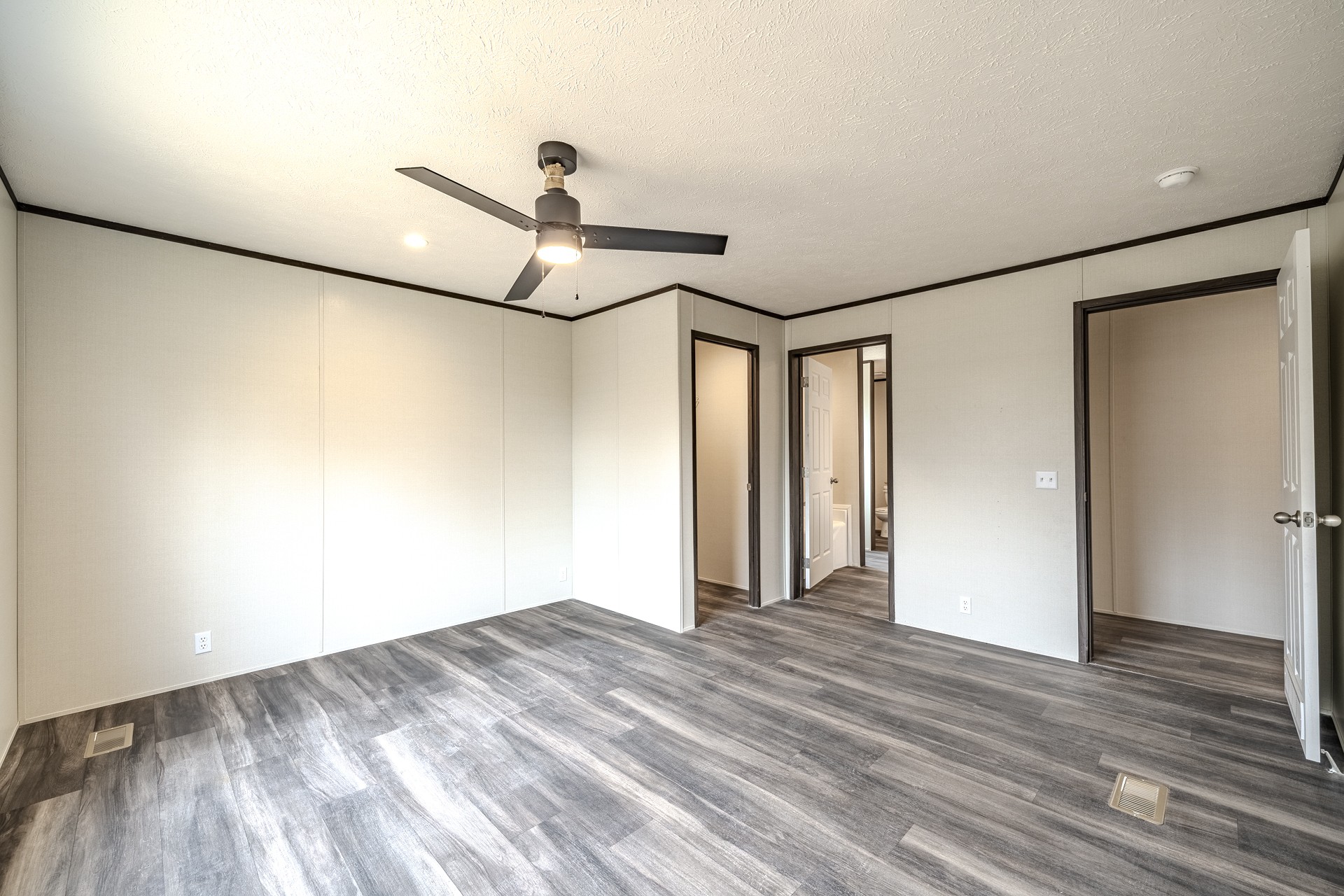 3615 Guys Chewalla Road Ramer, TN 38367 - Photo 32 of 65 a view of empty room with wooden floor and fan