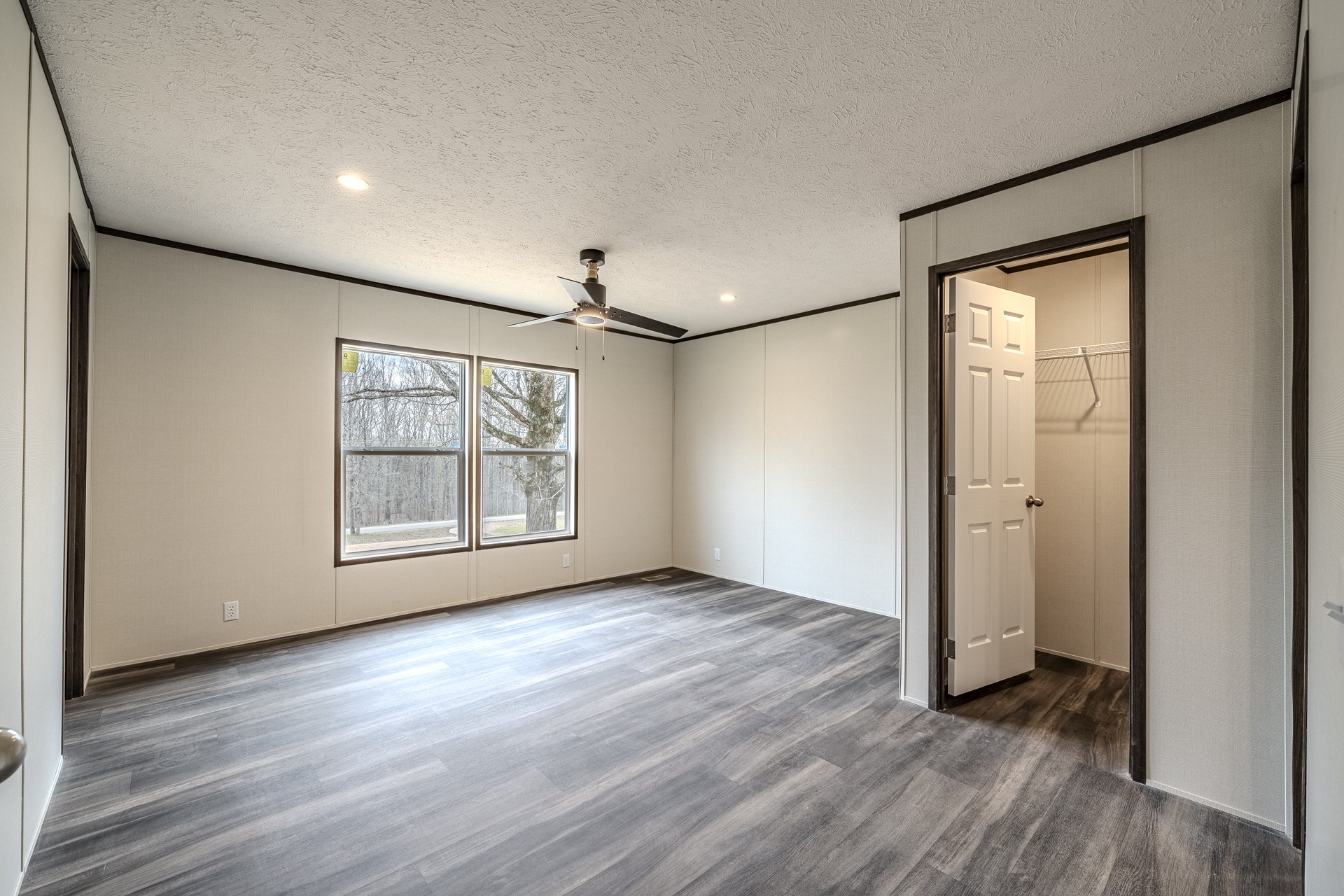 3615 Guys Chewalla Road Ramer, TN 38367 - Photo 33 of 65 an empty room with wooden floor and windows