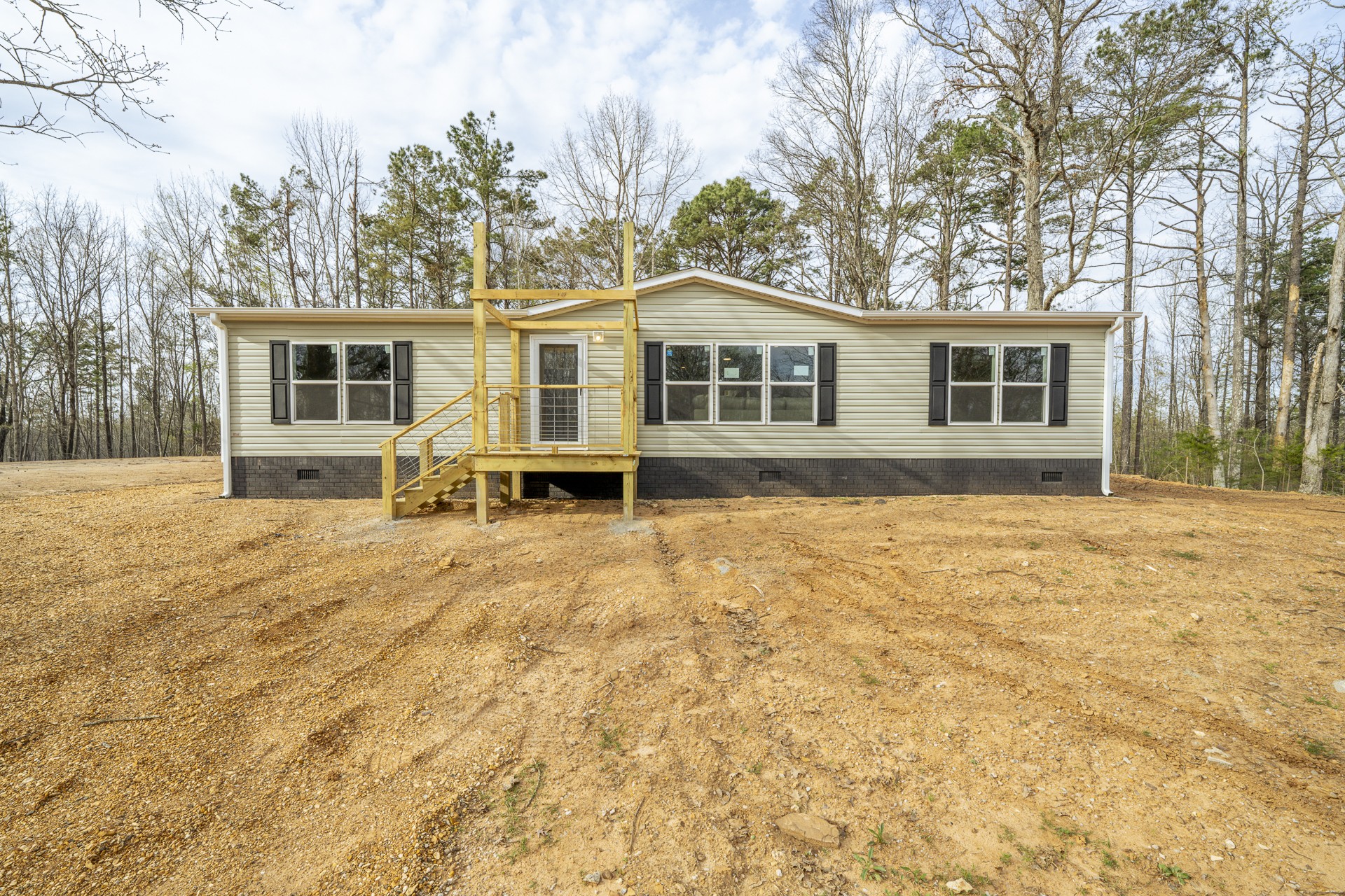 3615 Guys Chewalla Road Ramer, TN 38367 - Photo 61 of 65 a front view of a house with a yard and trees
