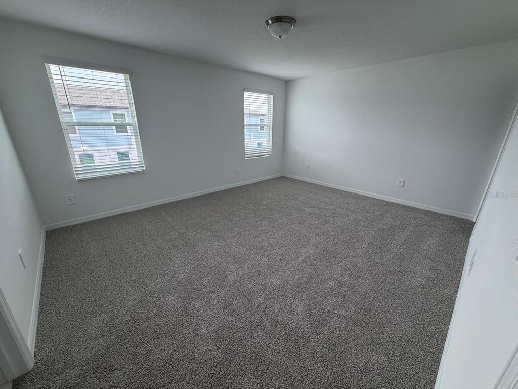 4244 Ranch House Road St. Cloud, FL 34772 - Photo 19 of 34 an empty room with windows