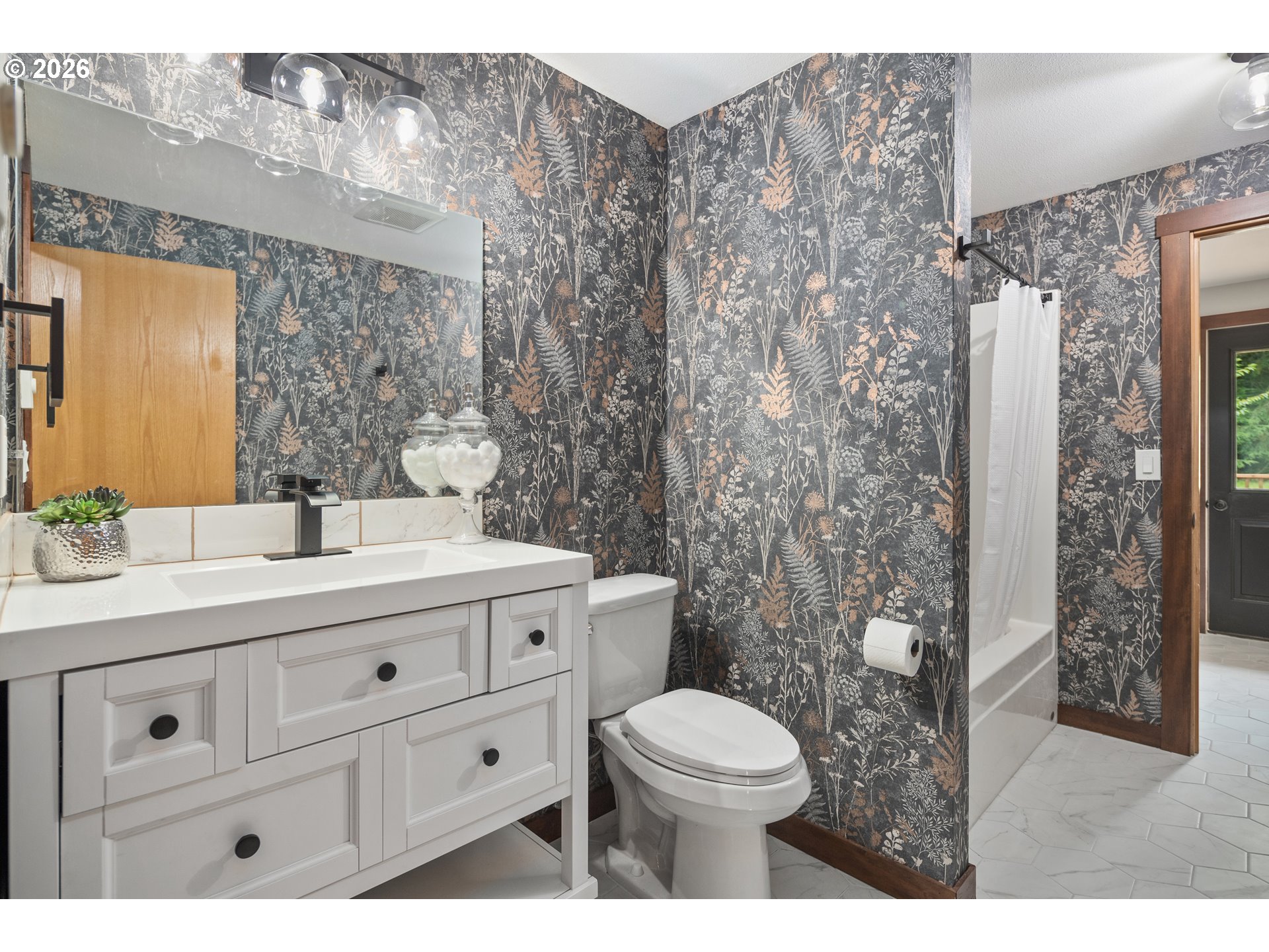 650 Marvin Road Tillamook, OR 97141 - Photo 22 of 48 a bathroom with a granite countertop toilet sink and mirror