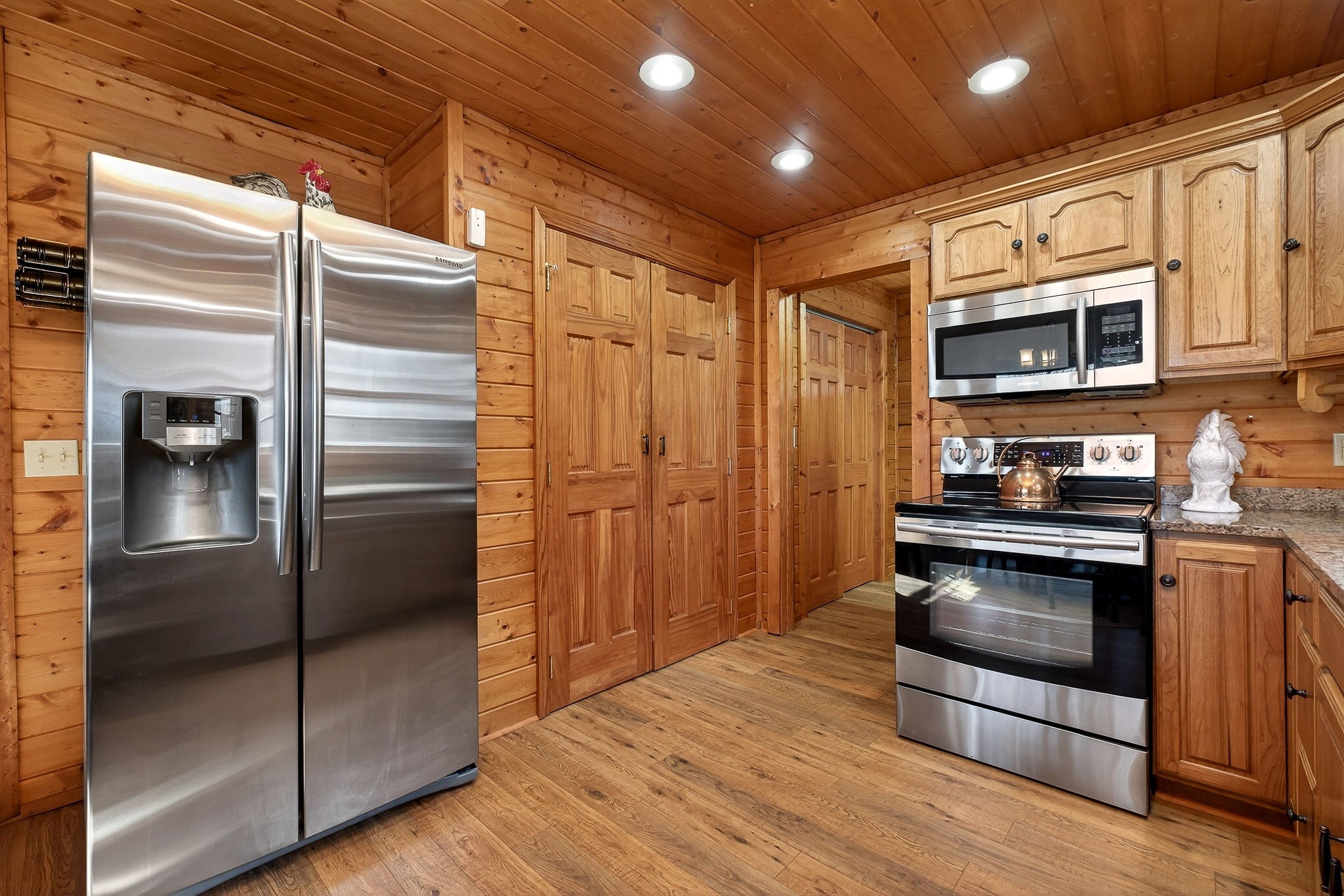 142 Rayahs Way Quebeck, TN 38579 - Photo 19 of 73 a kitchen with stainless steel appliances granite countertop a refrigerator and a stove