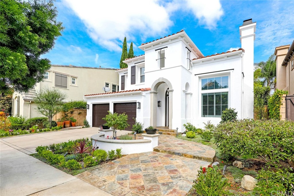 39 Whitehall Newport Beach, CA 92660 - Photo 1 of 35 a front view of a house with a garden