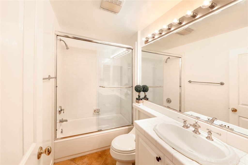 39 Whitehall Newport Beach, CA 92660 - Photo 12 of 35 a bathroom with a sink mirror toilet and shower