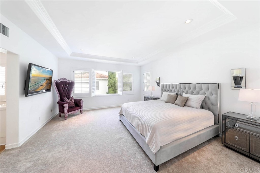 39 Whitehall Newport Beach, CA 92660 - Photo 17 of 35 a bedroom with a bed chair and window