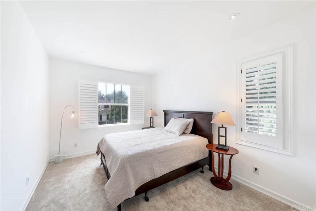 39 Whitehall Newport Beach, CA 92660 - Photo 20 of 35 a bedroom with a bed and a window