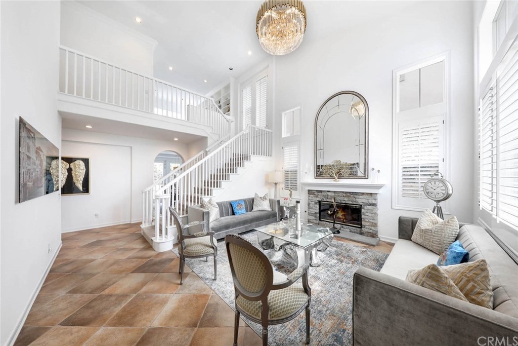 39 Whitehall Newport Beach, CA 92660 - Photo 3 of 35 a living room with furniture or fireplace and a large window