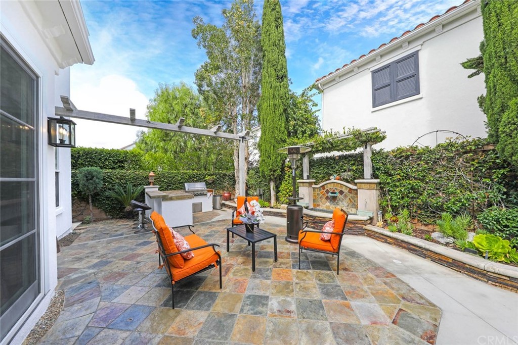 39 Whitehall Newport Beach, CA 92660 - Photo 23 of 35 a backyard of a house with outdoor seating