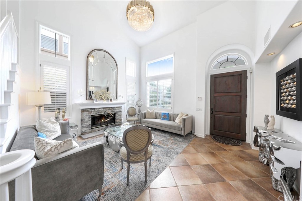 39 Whitehall Newport Beach, CA 92660 - Photo 4 of 35 a living room with furniture a fireplace and a table