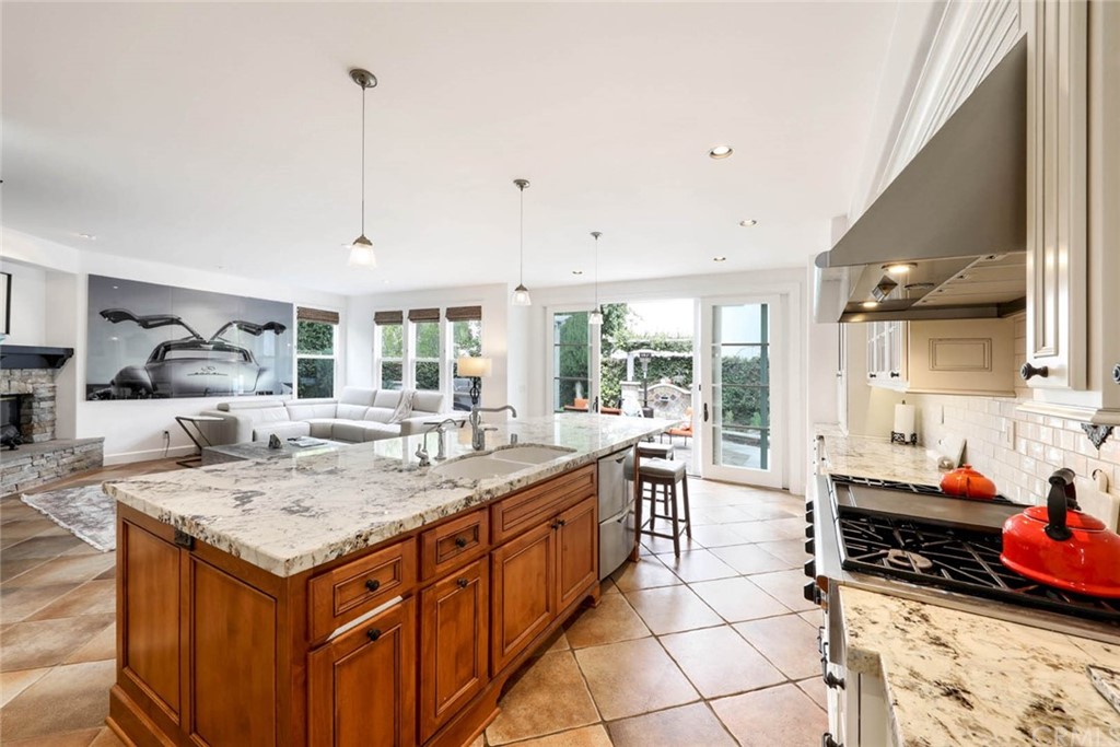 39 Whitehall Newport Beach, CA 92660 - Photo 9 of 35 a kitchen that has a sink and a stove