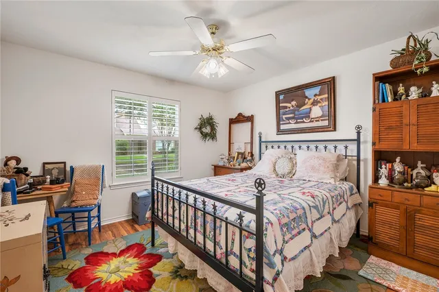 a bedroom with bed and a window