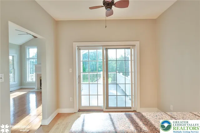a view of an entryway with wooden floor
