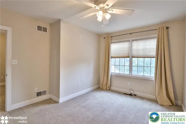 a view of a park with large trees