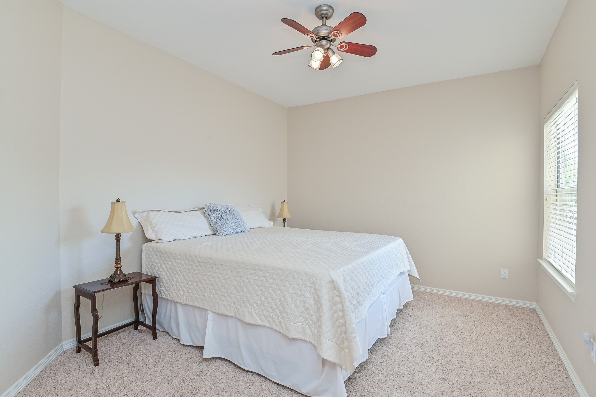 7218 Spring Run Lane Katy, TX 77494 - Photo 31 of 49 a bedroom with a bed and a window