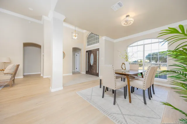 a dining room with furniture and window