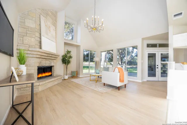 a living room with furniture and a fireplace