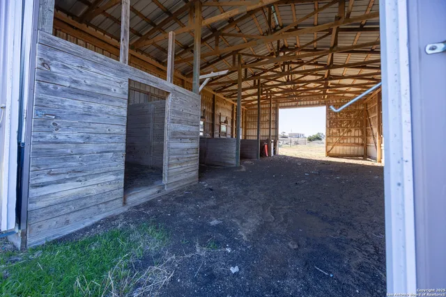 a view of an empty room with a empty space and wooden deck