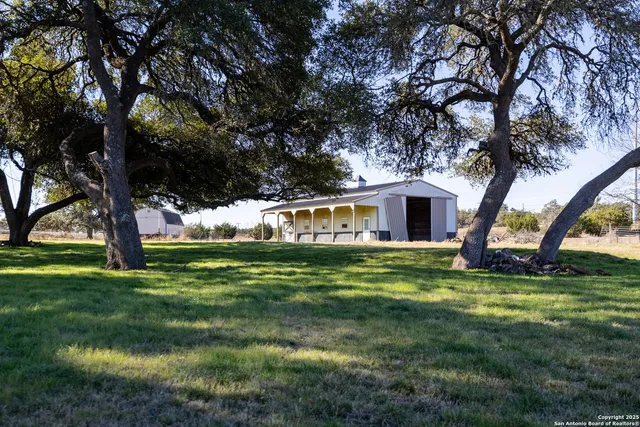 a view of a house with a big yard