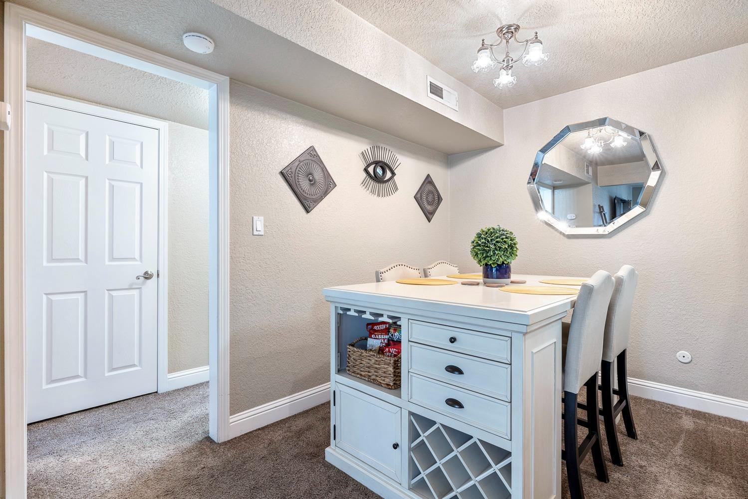 2881 Huntington Boulevard, Unit 137 Fresno, CA 93721 - Photo 11 of 29 a view of a dining room with a table and chairs