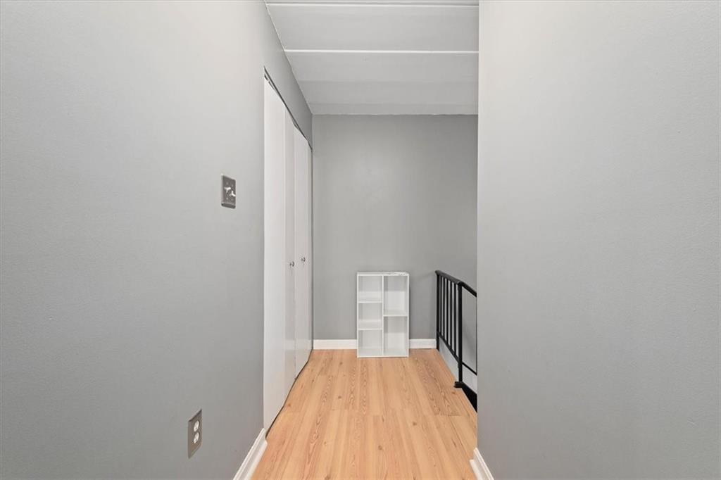 2034 Swallow Hill Road, Unit 204 Pittsburgh, PA 15220 - Photo 13 of 23 Upstairs Hallway with Laundry Access on the Left