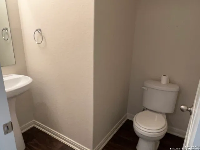 a kitchen with a sink and a refrigerator