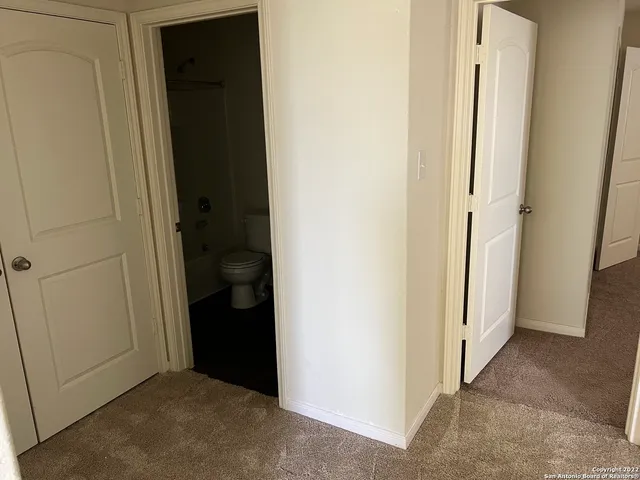 a view of a bedroom from hallway