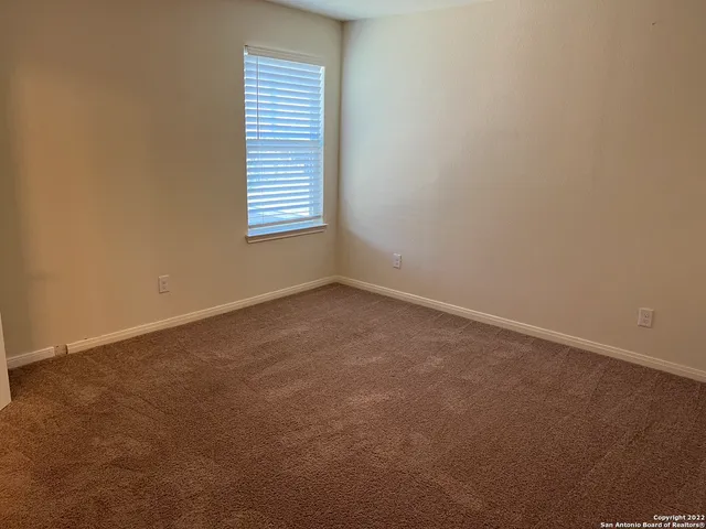 an empty room with closet area