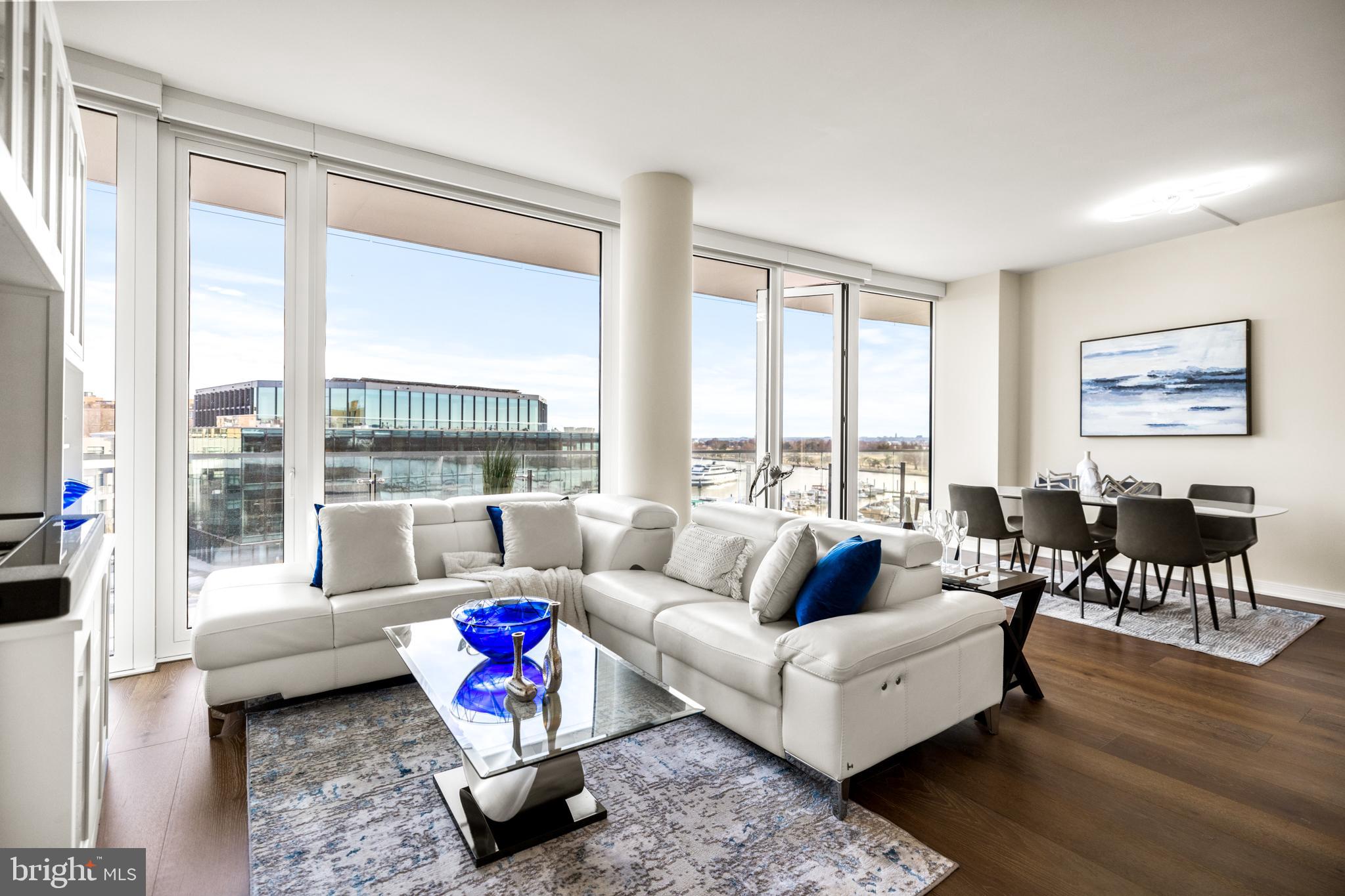 601 Wharf Street Southwest, Unit 602 Washington, DC 20024 - Photo 11 of 104 a living room with furniture and a large window