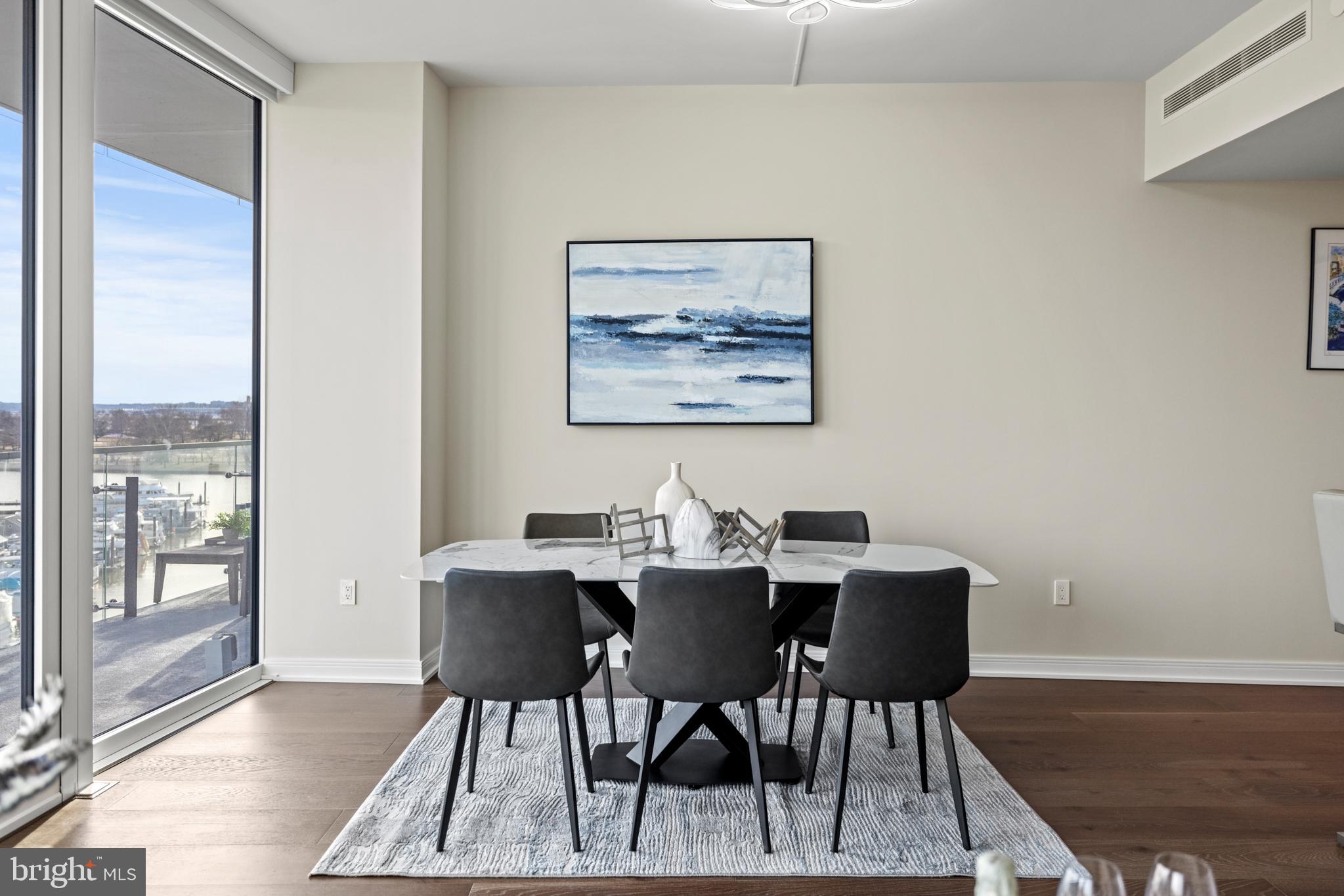 601 Wharf Street Southwest, Unit 602 Washington, DC 20024 - Photo 18 of 104 a view of a dining room with furniture and wooden floor